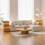 Sikaic 3-Piece Sofa Set — White sofa plus two natural-colored side tables.